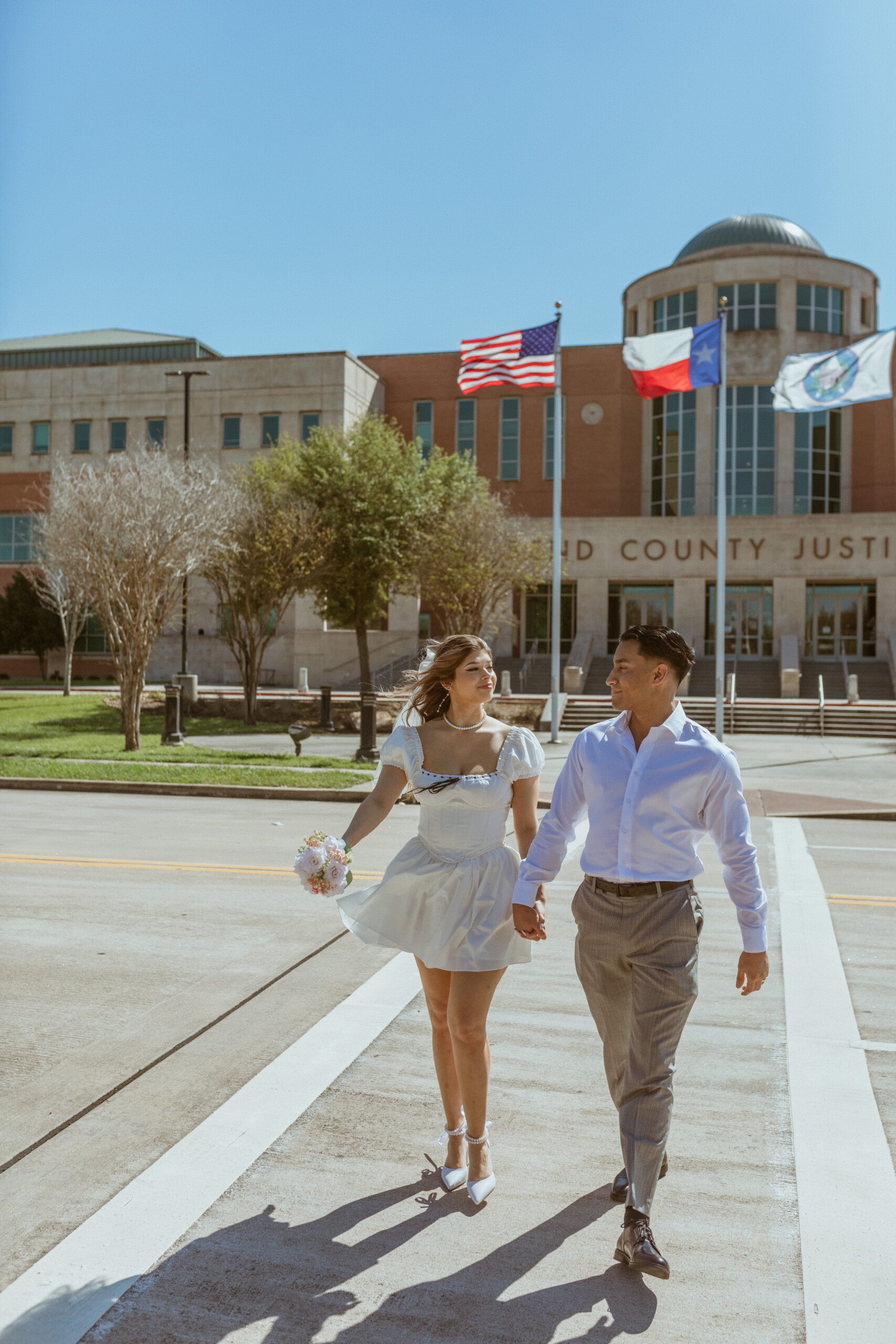 Couple walking in the street after their Courthouse Elopement
