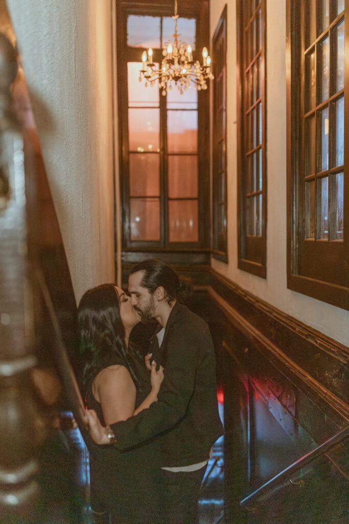 Couple kissing on a staircase