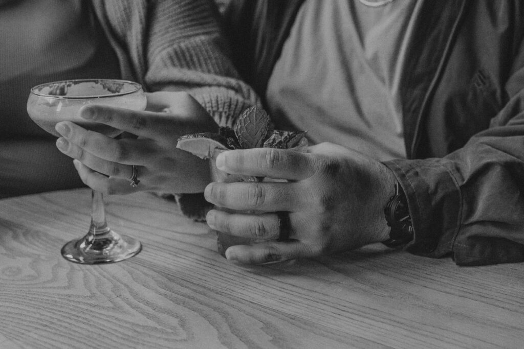 Man's hand holding a drink during his  1st Year Anniversary Photoshoot with his wife