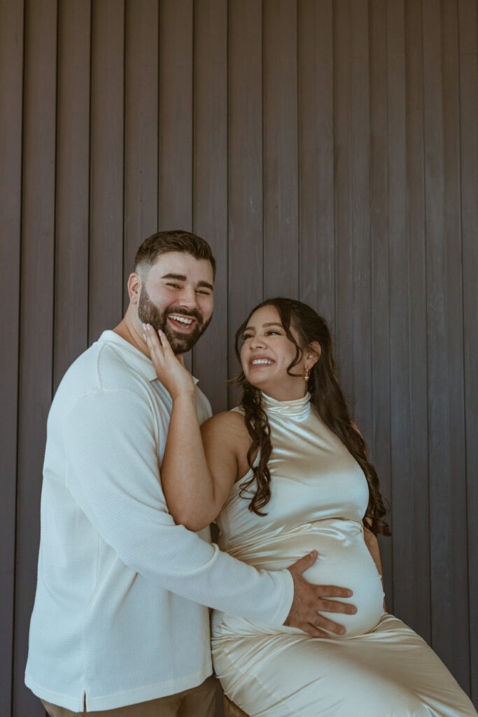 Couple posing during their winter maternity photoshoot.