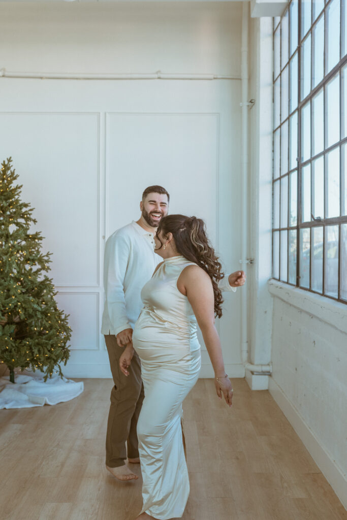 couple dancing inside a studio during their photoshoot