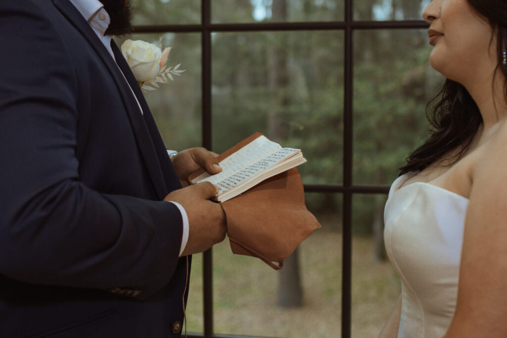 Notebook with vows written on it.