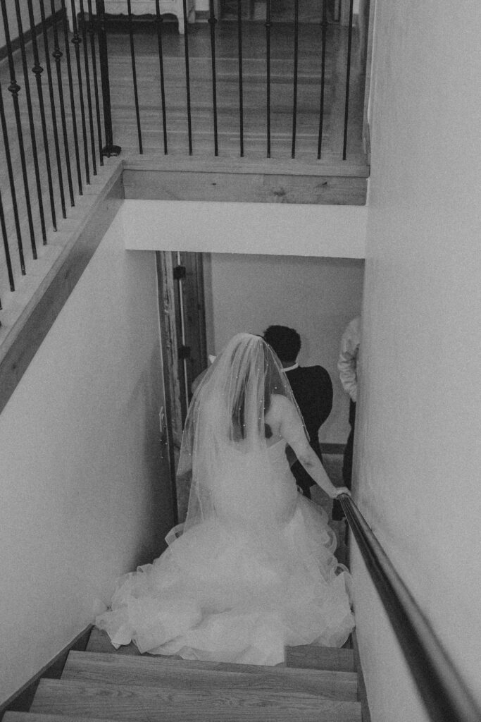 Couple walking down the stairs during their wedding.