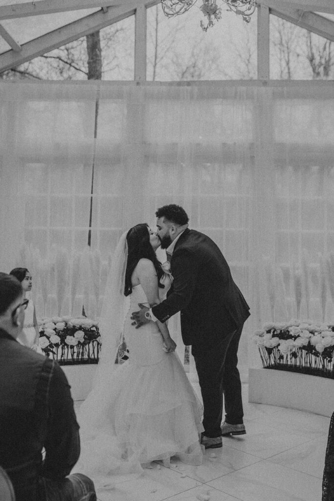 Couple kissing at the wedding ceremony.