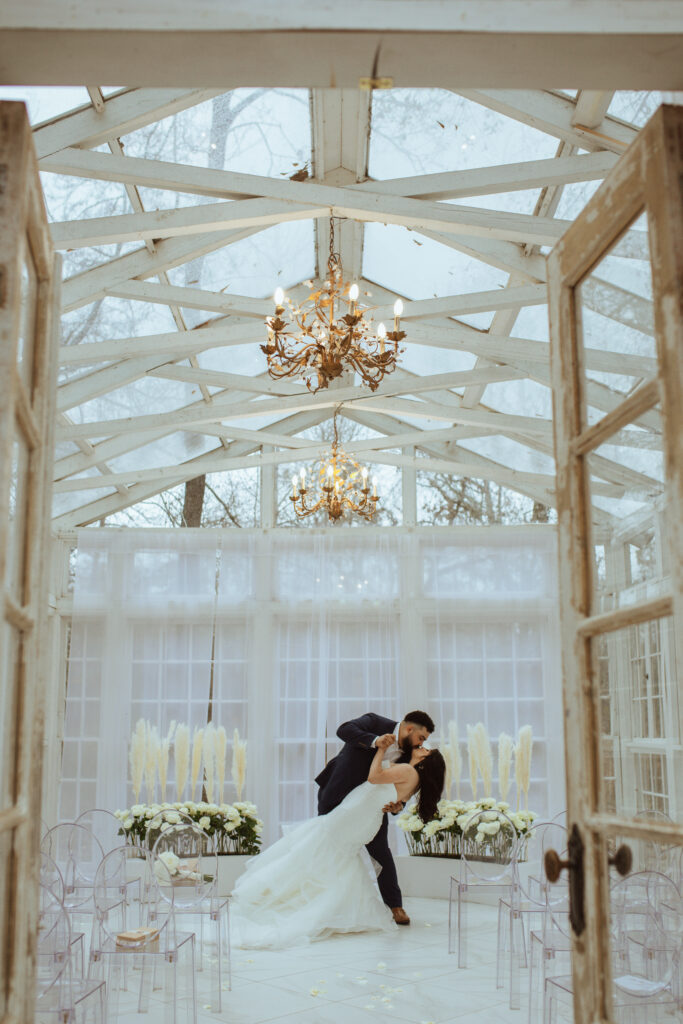 Couple taking photos during their wedding at the Oak Atelier.