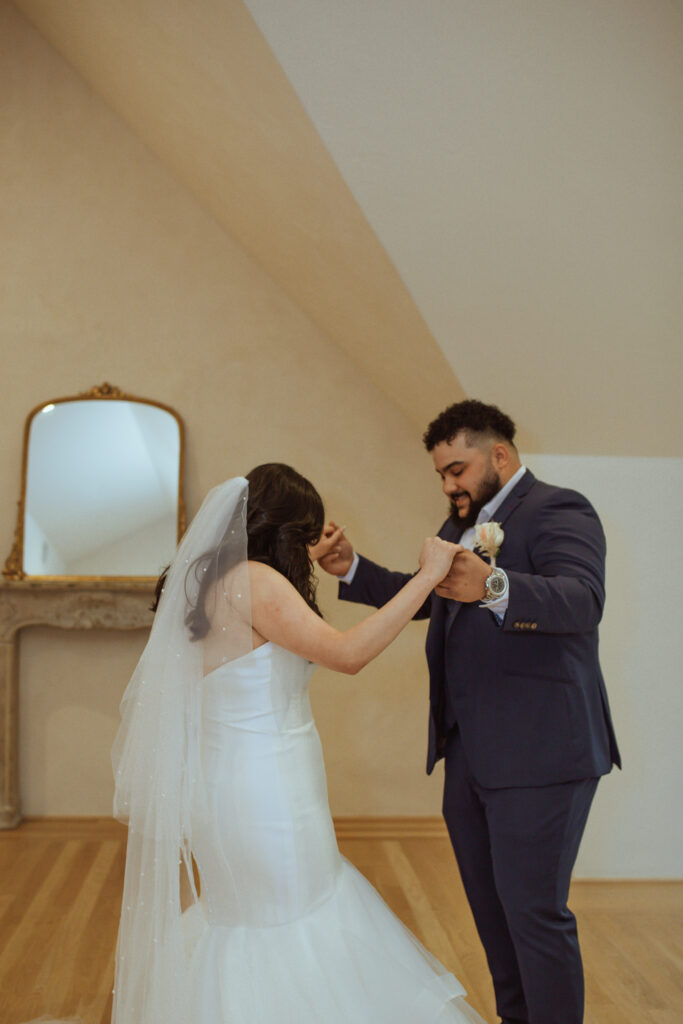 Couple holding hands at the Oak Atelier.