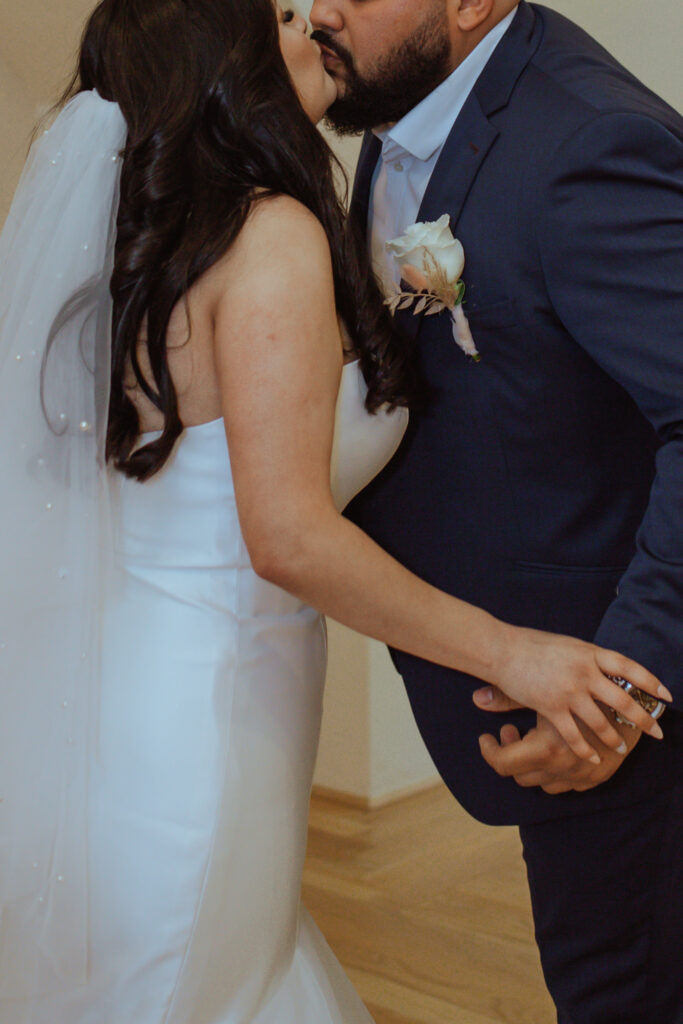 Couple holding hands during their wedding photos at the Oak Atelier.