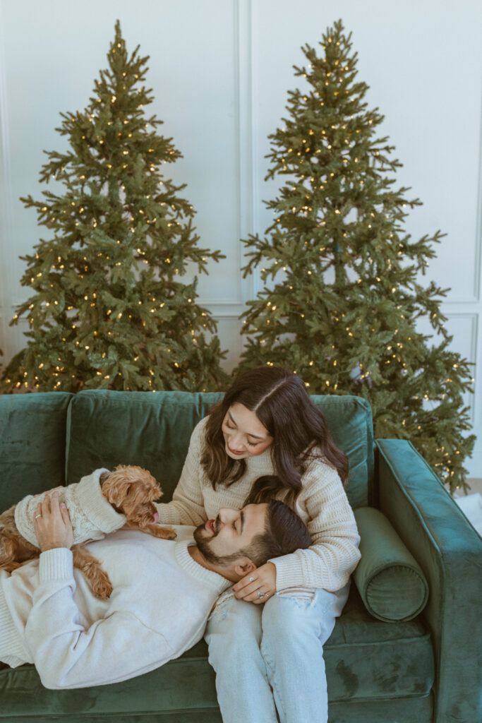 Couple with their dog during a winter photoshoot.