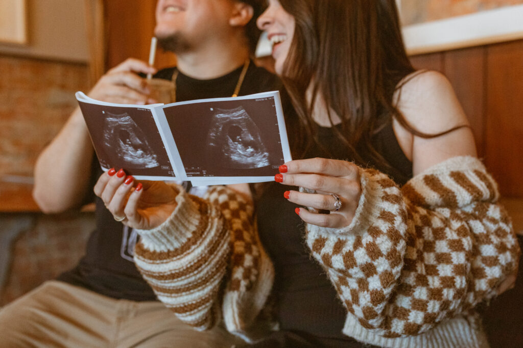 Couple holding an ultrasound at Catalina Coffee